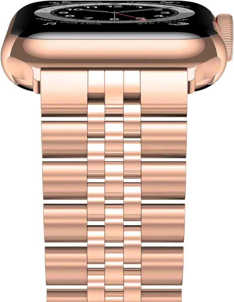 Rose gold stainless steel Apple Watch band worn on wrist