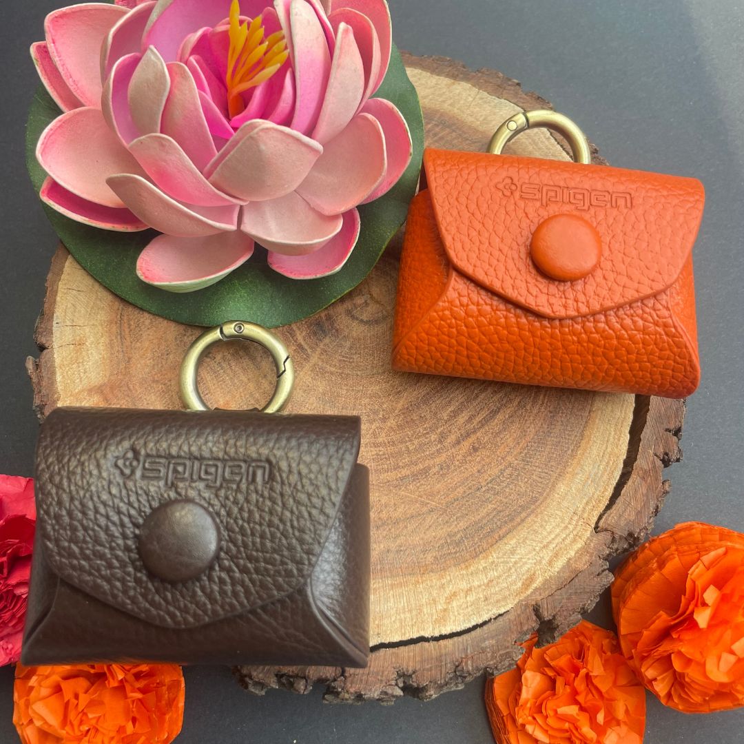 Royal leather AirPods case golden ring and snap button closure detail
