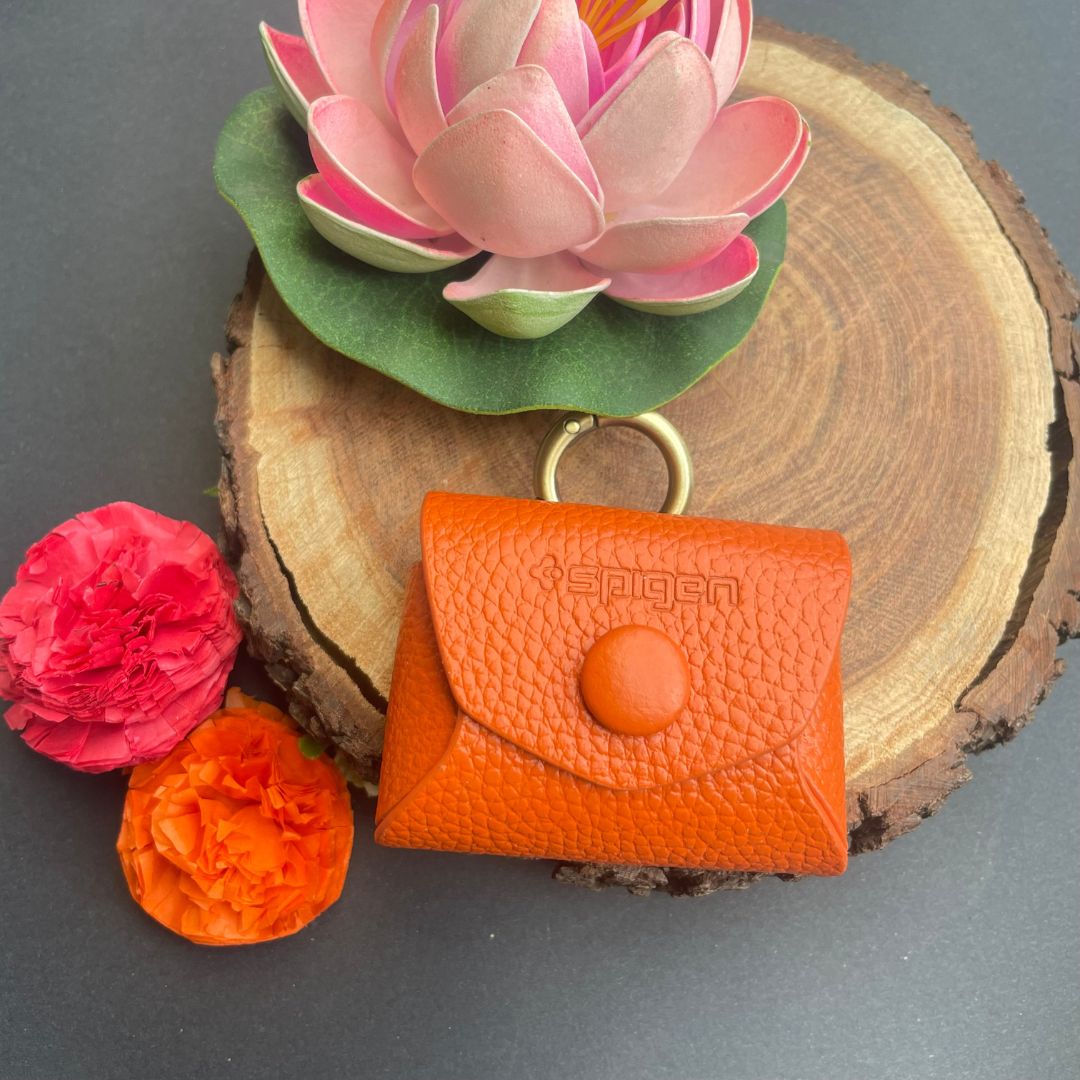 Royal leather AirPods case with golden ring in orange